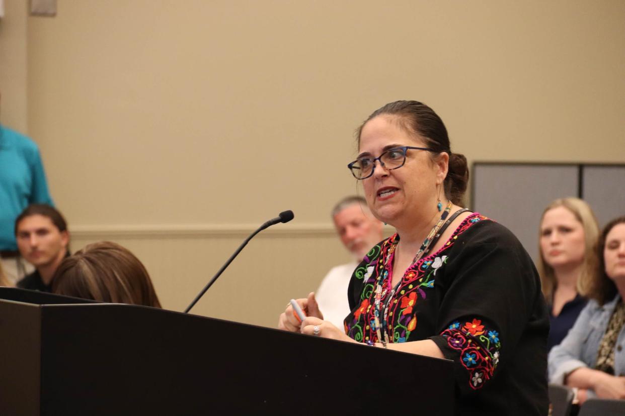 Keri Weathers, a Lost Pines Elementary second grade teacher, speaks at the Bastrop school board's meeting on April 16. The board is looking at budget cuts, including to early child literacy coaches. "Because of my literacy coach, we've survived," Weathers said. "And I mean treading water."