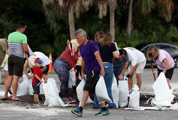 People fill sandbags at Helen Howarth Park as they prepare for the possible arrival of Hurricane Ian on September 26, 2022, in St. Petersburg, Florida.