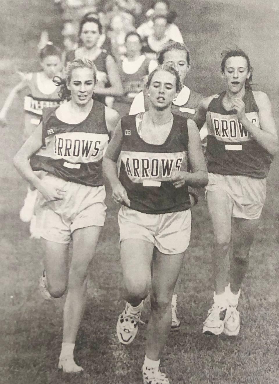 Watertown runners Kelly Dugan (left), Alyssa Rudebusch (center) and Jessica Fox compete in a home cross country meet in October of 1996.