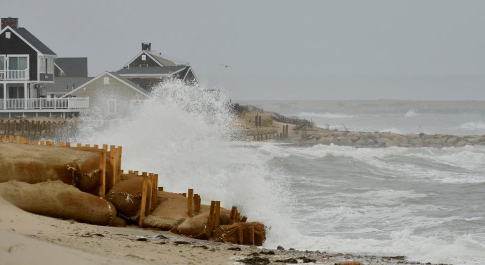 Waves crash along Town Neck Beach in Sandwich around high tide Monday morning.