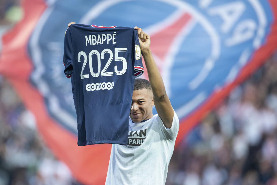 PARIS, FRANCE - May 21: Kylian Mbappé #7 of Paris Saint-Germain announces his decision to stay with the club for three more years in an on-field presentation before the Paris Saint-Germain Vs Metz, French Ligue 1 regular season match at Parc des Princes on May 21st 2022 in Paris, France (Photo by Tim Clayton/Corbis via Getty Images)