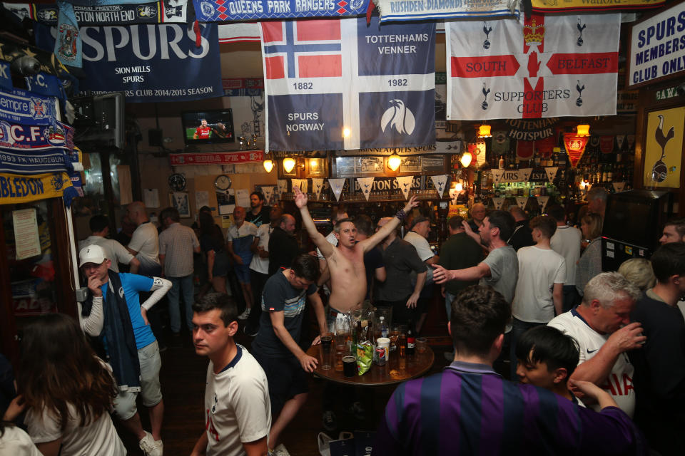 Tottenham Hotspur fans look dejected at full time as they watch the UEFA Champions League Final at The Bricklayers Pub, London.