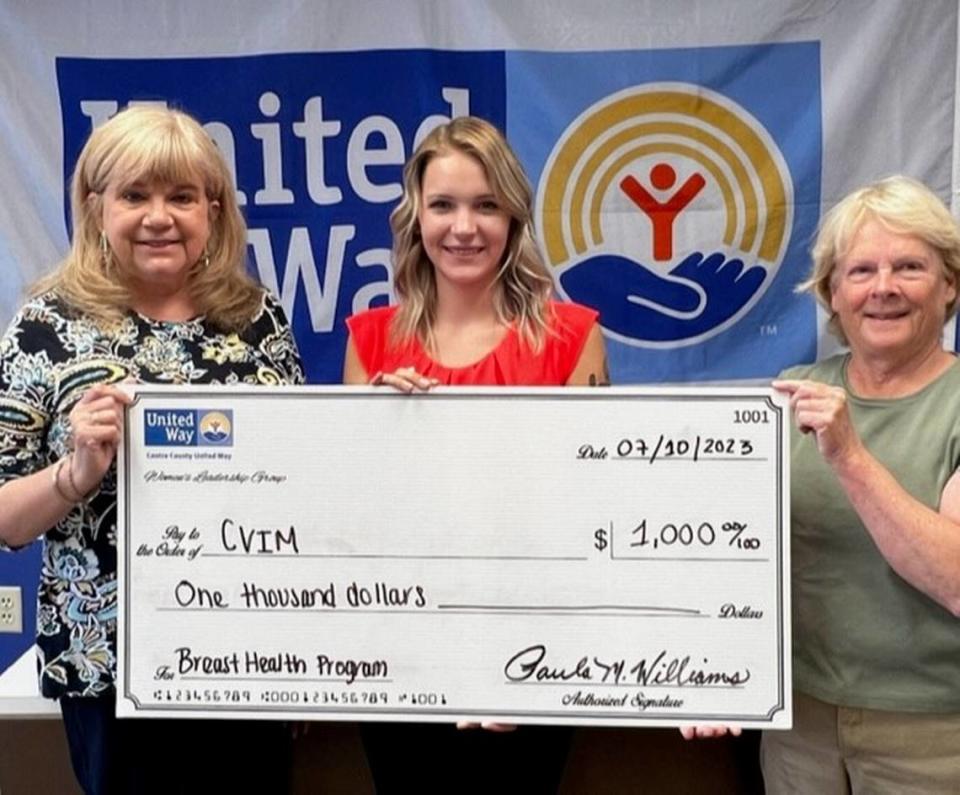From left: Centre County United Way Executive Director Paula Williams, Centre Volunteers in Medicine Marketing Coordinator Darion Shawley and Women United Chair Barbara Sherlock pose after CVIM was awarded a 1,000 grant.