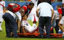 Costa Rica's Cristian Gamboa is carried off the pitch, to be substituted by Costa Rica's Dave Myrie, during the 2014 World Cup quarter-finals between Costa Rica and the Netherlands at the Fonte Nova arena in Salvador July 5, 2014. REUTERS/Paul Hanna