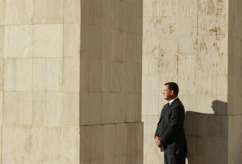 USC athletic director Mike Bohn stands inside the Coliseum.