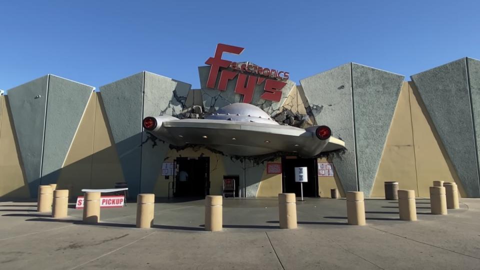 The entrance to Frys Electronics which has a crashed alien space ship above the door