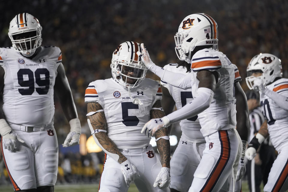 Auburn safety Donovan Kaufman (5) celebrates with teammates after recovering a fumble by California running back Isaiah Ifanse during the first half of an NCAA college football game Saturday, Sept. 9, 2023, in Berkeley, Calif. (AP Photo/Godofredo A. Vásquez)