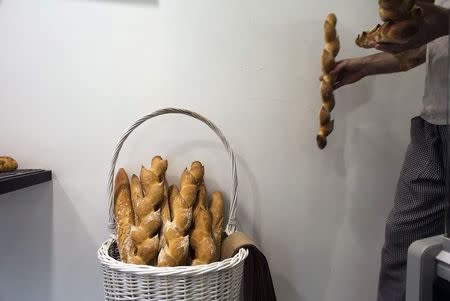 A member of the French community works in a patisserie in Netanya, a city of 180,000 on the Mediterranean north of Tel Aviv, that has become the semi-official capital of the French community in Israel January 25, 2015. REUTERS/Ronen Zvulun