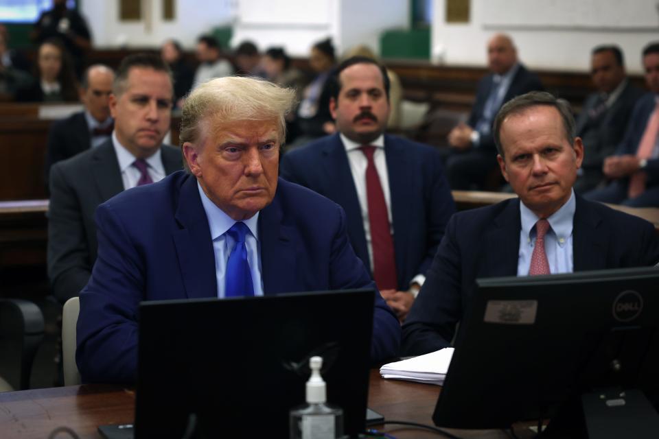 Former President Donald Trump sits in court with his attorney Christopher Kise during his civil fraud trial at New York State Supreme Court on October 24, 2023 in New York City. The former president may be forced to sell off his properties after Justice Arthur Engoron canceled his business certificates and ruled that he committed fraud for years while building his real estate empire after being sued by Attorney General Letitia James, seeking $250 million in damages. The trial will determine how much he and his companies will be penalized for the fraud.