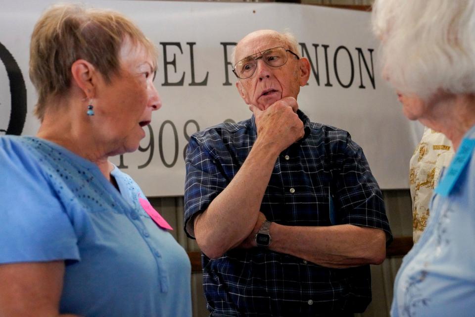 Dave Rendel, 86, of Eaton Rapids, listens to Janet Kemp, 78, of Ann Arbor tell a story during the 115th annual Rendel Family Reunion in Milan on July 30, 2023. Despite the large turnout at the reunion, the Rendel name seems rare with the marriages in the family. "Let me know if you find another Rendel," Rendel said.