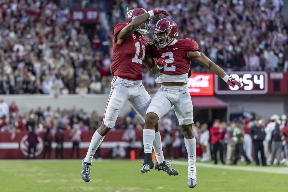 Alabama wide receiver Traeshon Holden (11) and running back Jase McClellan (2) celebrate after Holden's touchdown during the first half of an NCAA college football game, Saturday, Nov. 26, 2022, in Tuscaloosa, Ala. (AP Photo/Vasha Hunt)