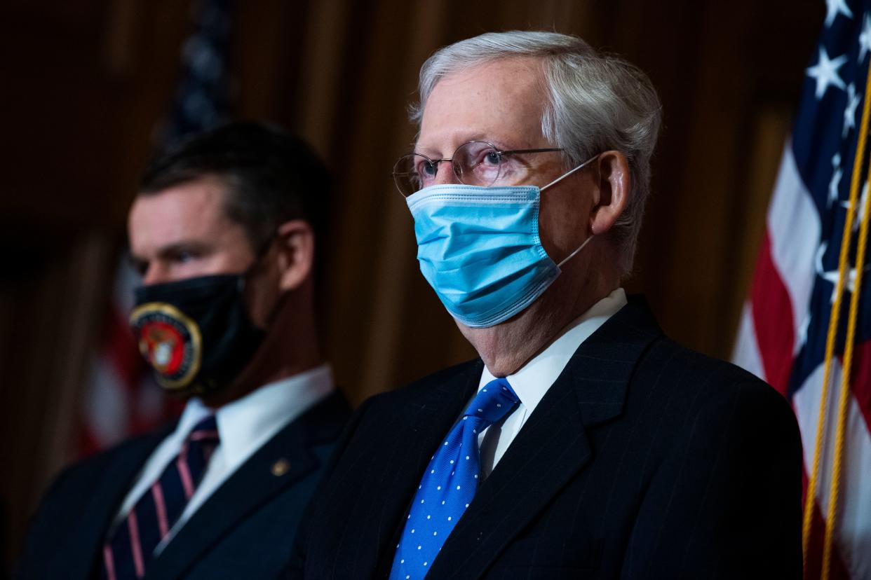 Senate Majority Leader Mitch McConnell (R) (R-KY), and Senator Todd Young (R-IN), hold a news conference after the Senate Republican Policy luncheon on Capitol Hill in Washington, DC on December 1, 2020. (Photo by Tom Williams / POOL / AFP) (Photo by TOM WILLIAMS/POOL/AFP via Getty Images)