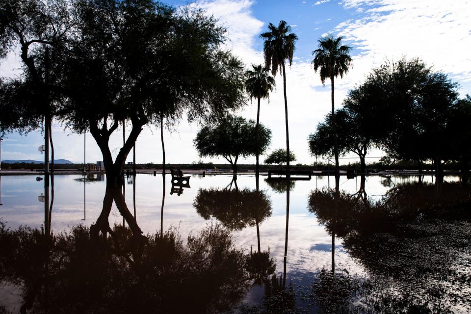 After a heavy and deadly monsoon rain The Neighborhood Park on Main Street is under water in Gila Bend, AZ, Aug. 14, 2021. Benjamin Chambers/The Republic