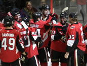 Ottawa Senators center Artem Anisimov, top center, is congratulated for his overtime goal against the Dallas Stars in an NHL hockey game Sunday, Feb. 16, 2020, in Ottawa, Ontario. (Justin Tang/The Canadian Press via AP)