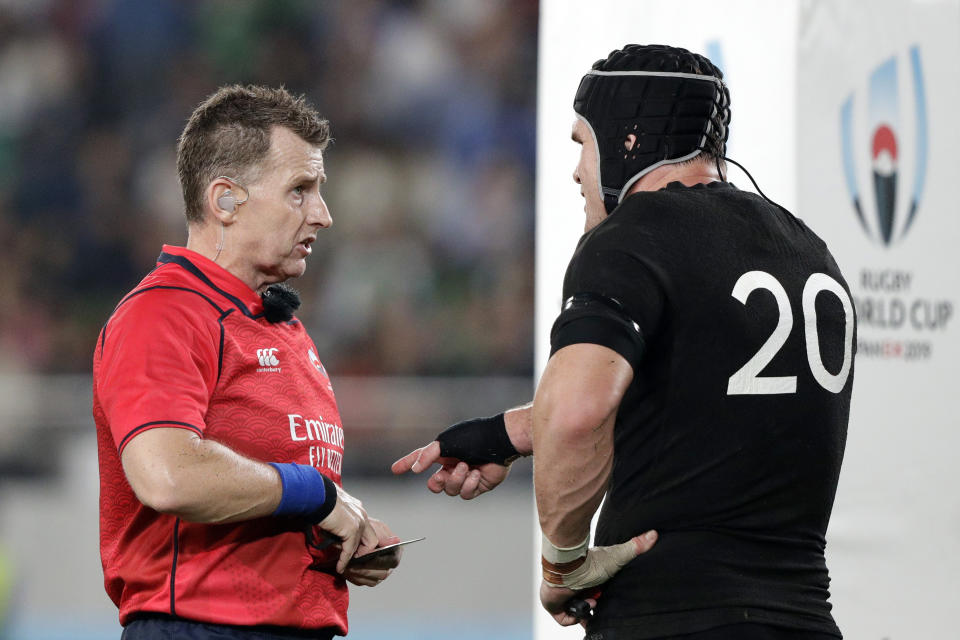 Referee Nigel Owens speaks to New Zealand's Matt Todd before showing yellow card during the Rugby World Cup quarterfinal match at Tokyo Stadium between New Zealand and Ireland in Tokyo, Japan, Saturday, Oct. 19, 2019. (AP Photo/Mark Baker)