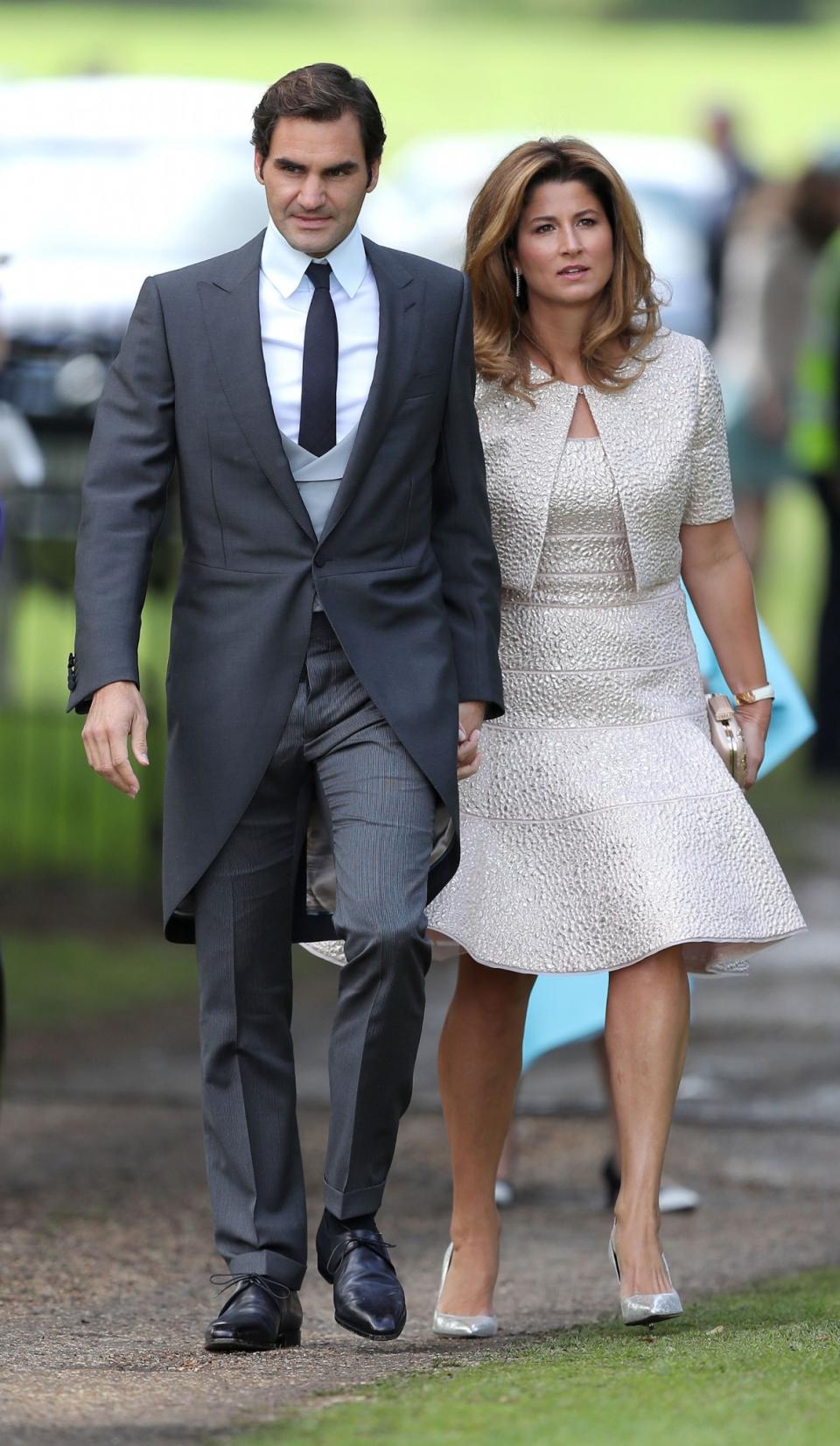 <p>The tennis star and his wife Mirka, who wore a fit-and-flare dress with a cropped jacket, were among some of the A-list attendees. (Photo: PA) </p>