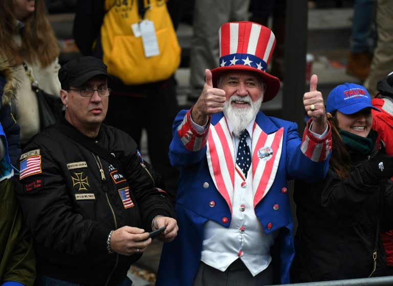 Cheers from supporters of US President Donald Trump and First Lady Melania drowned out boos from protesters along the inaugural route