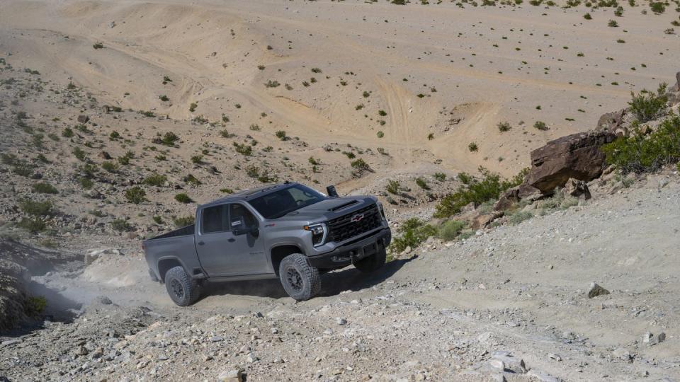 the 2024 silverado hd zr2 bison climbing an off road trail