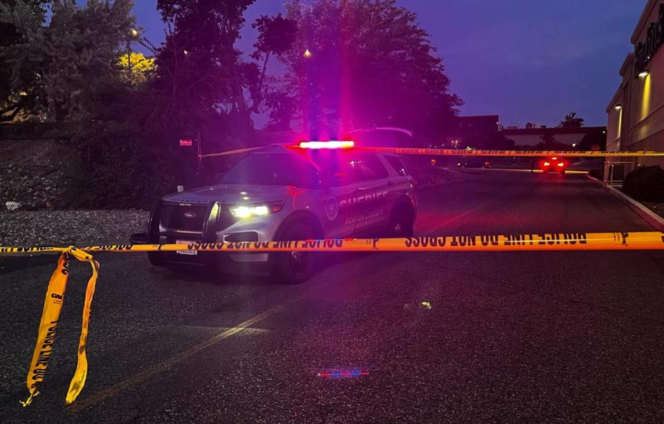 A Benton County Sheriff’s Office patrol vehicle is parked behind yellow police line tape near the HomeGoods store in Kennewick following an officer-involved shooting of a carjacking suspect. Courtesy BCSO