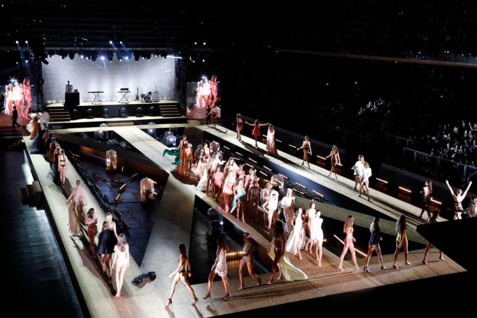 TOPSHOT - Models present creations during the Etam Live Show on the first day of the Paris Fashion Week, at the Roland Garros stadium in Paris, on September 24, 2019. (Photo by GEOFFROY VAN DER HASSELT / AFP) (Photo by GEOFFROY VAN DER HASSELT/AFP via Getty Images)