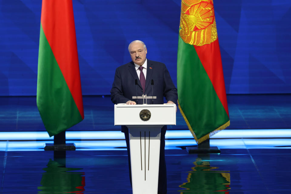 In this photo provided by the Belarusian Presidential Press Service, Belarusian President Alexander Lukashenko delivers a state-of-the nation address in Minsk, Belarus, Friday, March 31, 2023. (Belarusian Presidential Press Service via AP)