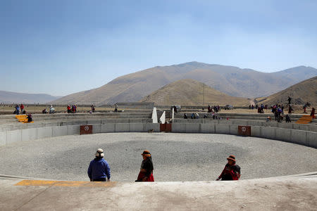 People clean a bullring in the town of Nueva Fuerabamba in Apurimac, Peru, October 3, 2017. REUTERS/Mariana Bazo