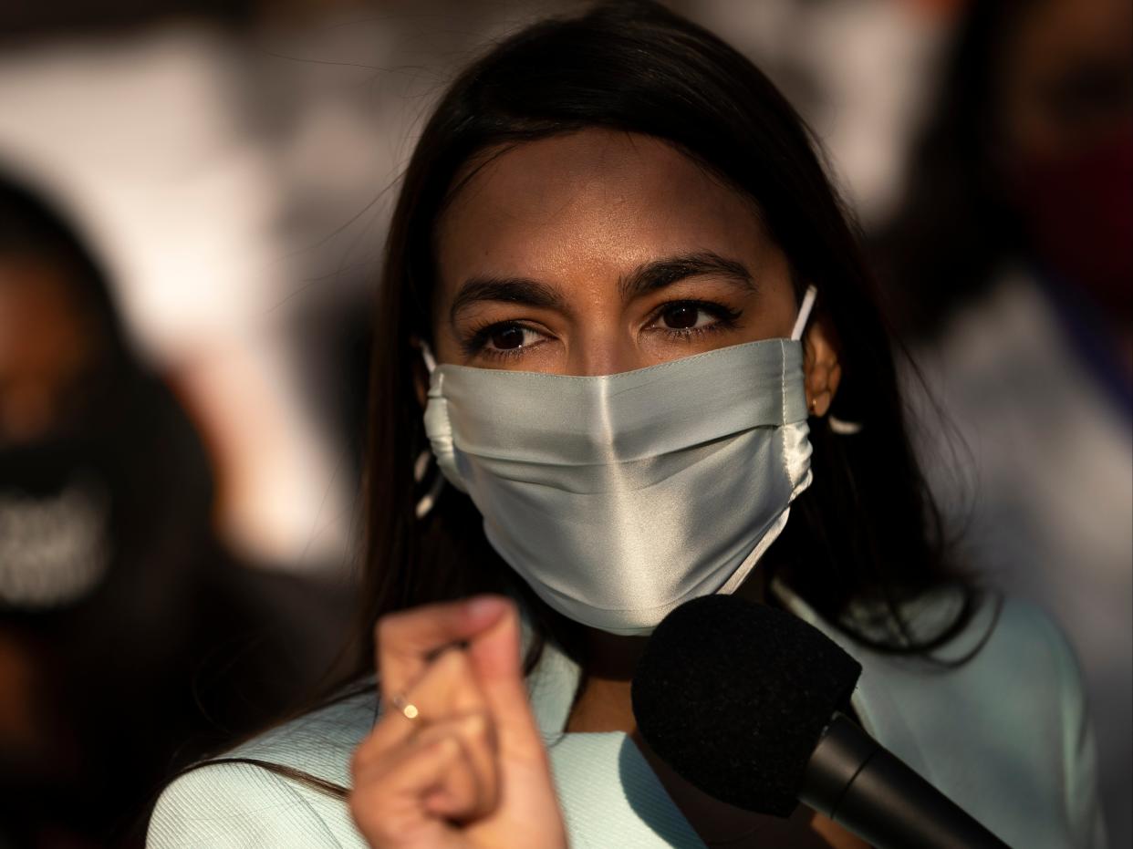 US Rep Alexandria Ocasio-Cortez speaks outside of the Democratic National Committee headquarters on 19 November, 2020 in Washington, DC. (Getty Images)