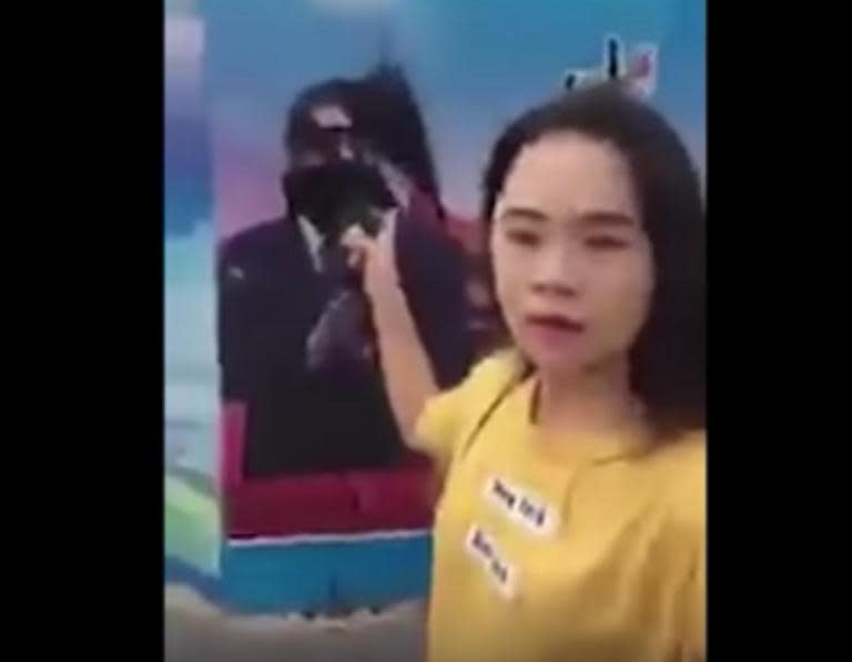 Chinese woman disappears after spraying ink on poster of Xi Jinping