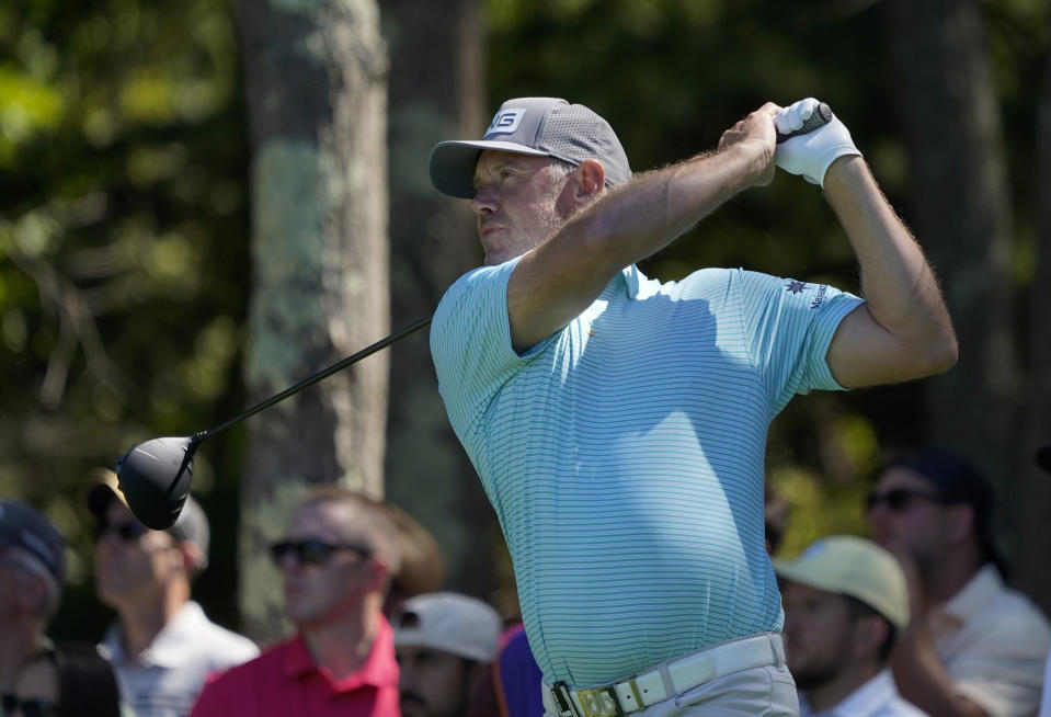 Lee Westwood follows through on his tee shot on the 18th hole during the first round of the LIV Golf tournament, Friday, Sept. 2, 2022, in Bolton, Mass. (AP Photo/Mary Schwalm)