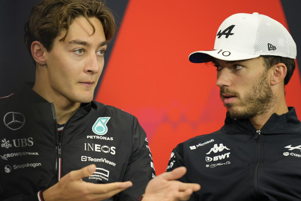 Mercedes driver George Russell of Britain, left, talks with Alpine driver Pierre Gasly of France during a news conference at the Suzuka Circuit in Suzuka, central Japan, Thursday, April 4, 2024, ahead of Sunday's Japanese Formula One Grand Prix. (AP Photo/Hiro Komae)