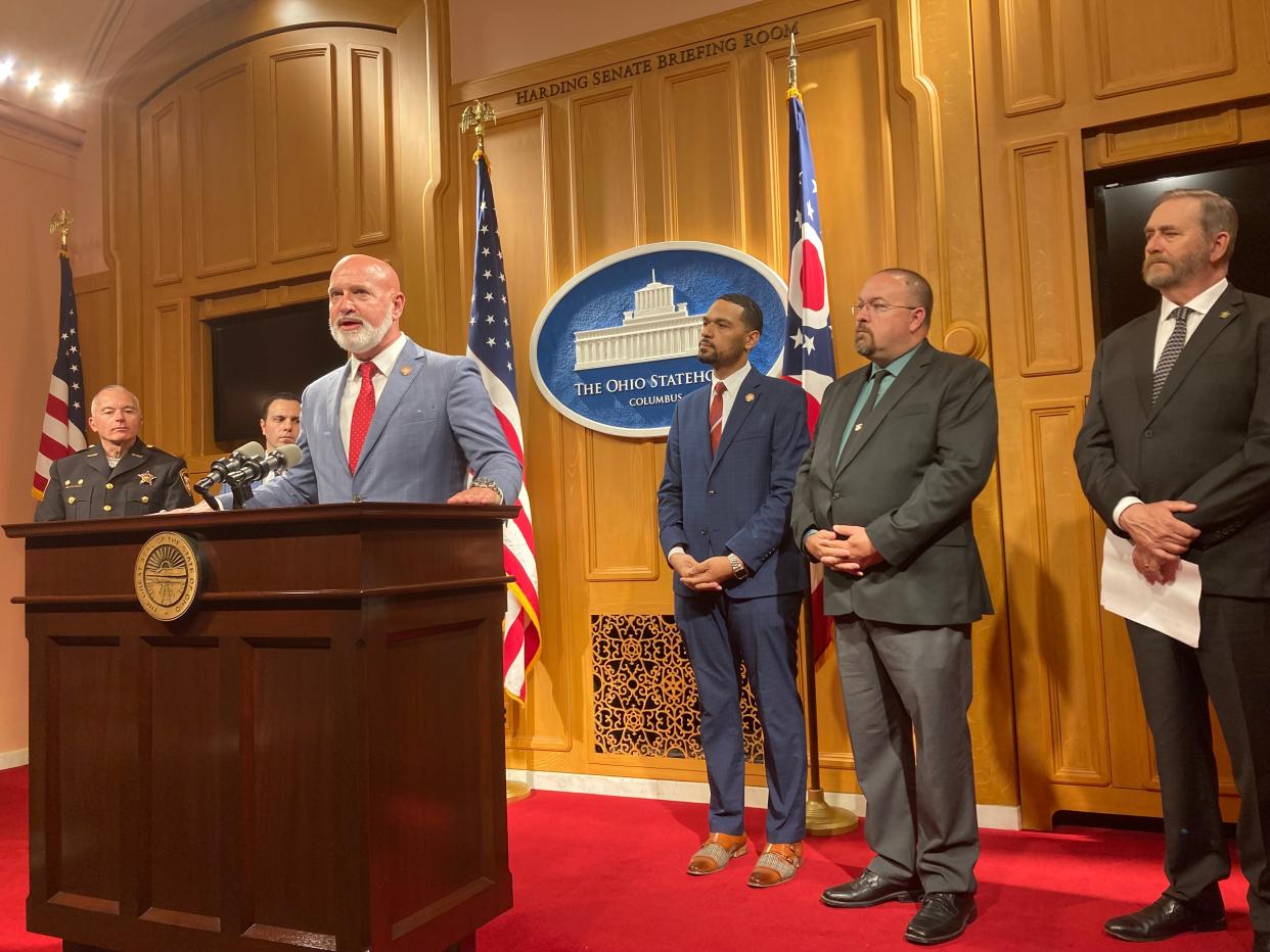 Rep. Bernie Willis, R-Springfield, center, and Rep. Josh Williams, R-Sylvania Township, third from the right, discuss their bill to increase penalties for repeat gun violence offenders. Ohio Attorney General Dave Yost, far right, supports the bill.