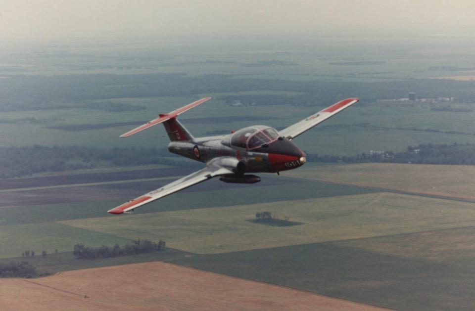 A CT-114 Tutor on a low-level navigation flight over the Canadian Prairies. This one has external fuel tanks, like the one we were flying in this story.<br>