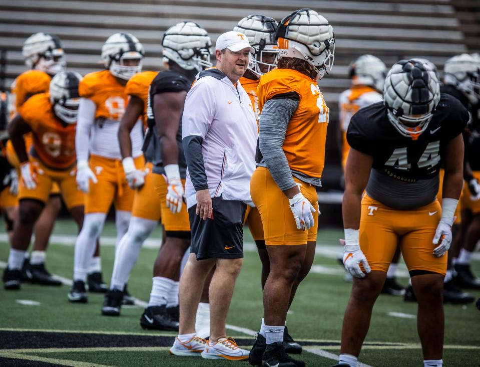 Head coach Josh Heupel interacts with players as they take the field for Tennessee’s first Nashville practice at Vanderbilt Stadium in preparation for their game in the Music City Bowl Sunday, December 26, 2021.