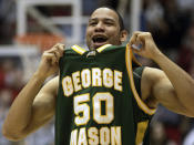 FILE - In this March 19, 2006, file photo, George Mason forward Sammy Hernandez (50) celebrates as George Mason beat North Carolina in the NCAA second-round men's basketball game in Dayton, Ohio. No one saw a Final Four run coming after the team that lost in the Colonial Athletic Association semifinals. George Mason beat Michigan State, North Carolina and Wichita State before taking down No. 1 seed Connecticut and its roster full of NBA talent, 86-84 in overtime. They lost 73-58 to eventual national champion Florida in the semifinals.(AP Photo/Al Behrman, File)