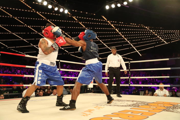 <p>John Chalen (red) battles Reshawn Merrick (blue) in the Bronx Precinct Callout during the NYPD Boxing Championships at the Hulu Theater at Madison Square Garden on March 15, 2018. (Gordon Donovan/Yahoo News) </p>