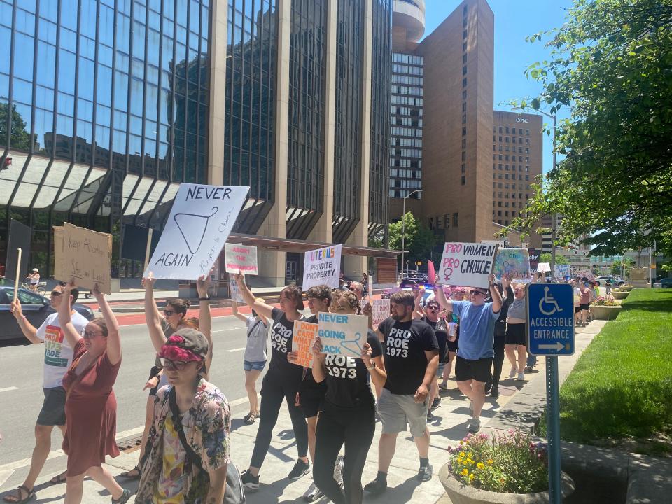 Abortion-rights advocates march around the Indiana Statehouse Sunday afternoon. Many chanted "Bans off our bodies" and "My body, my choice."