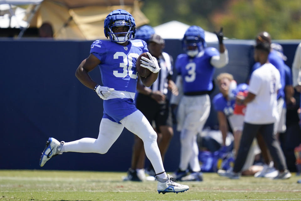 Los Angeles Rams running back Raymond Calais (30) participates in drills at the NFL football team's practice facility in Irvine, Calif. Monday, Aug. 8, 2022. (AP Photo/Ashley Landis)