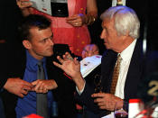 Benaud alongside Adam Gilchrist at a function to commemorate the first Test Match between Australia and the West Indies at The Gabba cricket ground in 1960. (2000)