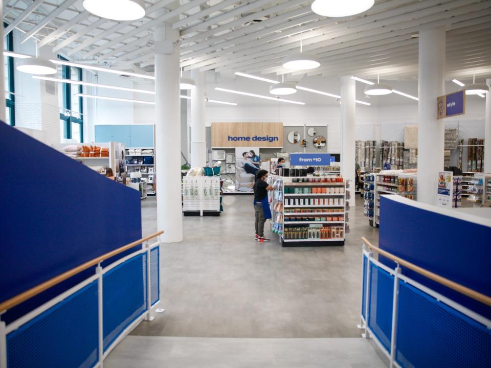 the hallway towards the back of the store with blue walls