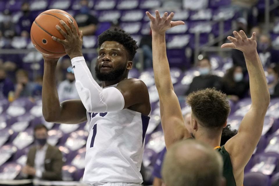 TCU guard Mike Miles (1) looks to the basket as North Dakota State guard Boden Skunberg defends during the second half of an NCAA college basketball game in Fort Worth, Texas, Tuesday, Dec. 22, 2020. (AP Photo/Tony Gutierrez)