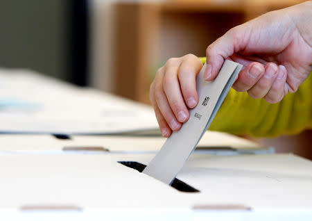 People cast their vote for the Bavarian state election in Neubiberg, Germany, October 14, 2018. REUTERS/Michaela Rehle