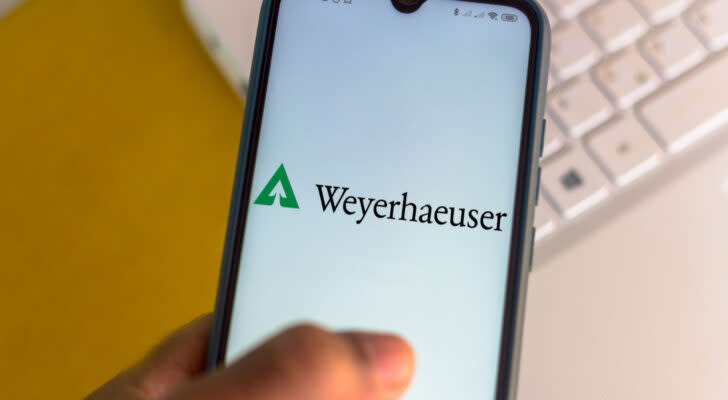 Weyergaeuser logo on a smartphone with a keyboard in the background.