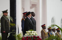 Iran's President Ebrahim Raisi, center-left, and Kenya's President William Ruto, center-right, stand for national anthems before meeting at State House in Nairobi, Kenya Wednesday, July 12, 2023. Iran's president has begun a rare visit to Africa as the country, which is under heavy U.S. economic sanctions, seeks to deepen partnerships around the world. (AP Photo/Khalil Senosi)