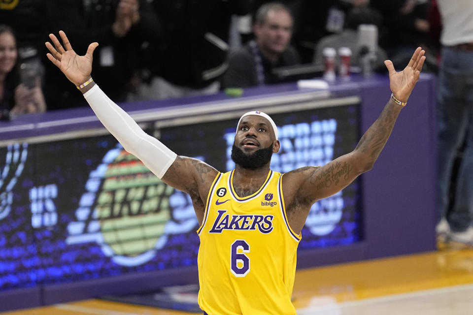 Los Angeles Lakers forward LeBron James celebrates after scoring to pass Kareem Abdul-Jabbar to become the NBA's all-time leading scorer during the second half of an NBA basketball game against the Oklahoma City Thunder Tuesday, Feb. 7, 2023, in Los Angeles. (AP Photo/Mark J. Terrill)