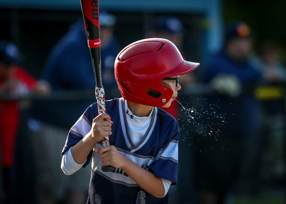 In a photo that shows the concentration of the hitter, Jayce Goncalves of Tremblay Bus stares intently toward the pitcher during his at bat at Whaling City Youth Baseball in New Bedford.