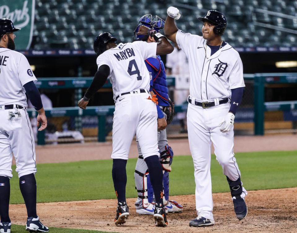 Tigers second baseman Jonathan Schoop celebrates with teammates at home plate after hitting a home run against the Cubs during the sixth inning at Comerica Park on Tuesday, Aug. 25, 2020.