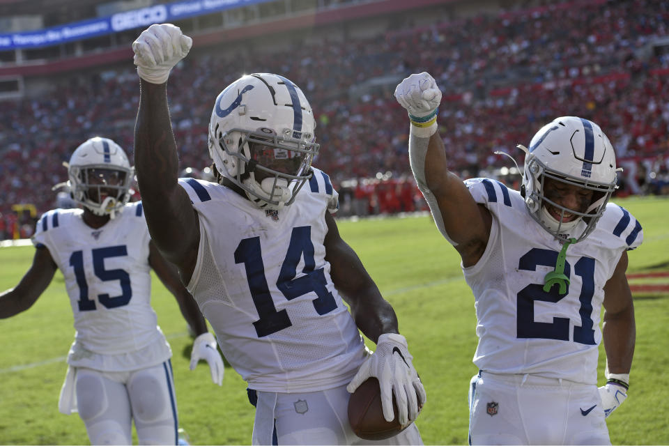 Indianapolis Colts wide receiver Zach Pascal (14) celebrates his touchdown against the Tampa Bay Buccaneers with running back Nyheim Hines (21) and wide receiver Parris Campbell (15) during the second half of an NFL football game Sunday, Dec. 8, 2019, in Tampa, Fla. (AP Photo/Jason Behnken)