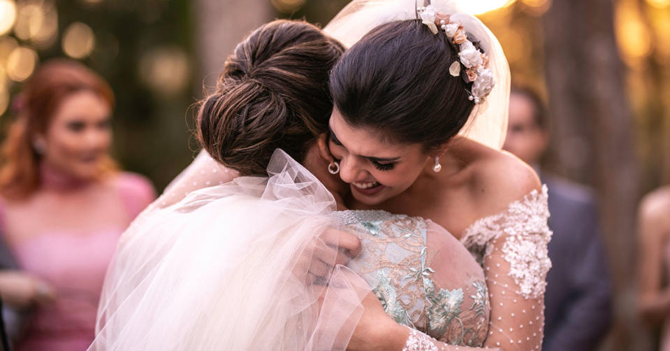 Bride hugging a guest at a wedding