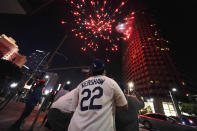 Baseball fans celebrate downtown after the Los Angeles Dodgers won the World Series over the Tampa Bay Rays Tuesday, Oct. 27, 2020, in Los Angeles. (AP Photo/Ashley Landis)