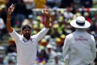 England's Monty Panesar (L) appeals unsuccessfully for leg before wicket against Australia's Chris Rogers (not seen) during the first day's play in the second Ashes test cricket match at the Adelaide Oval December 5, 2013.